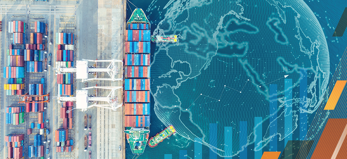 An overhead shot of a cargo ship at sea, filled with colorful shipping containers.